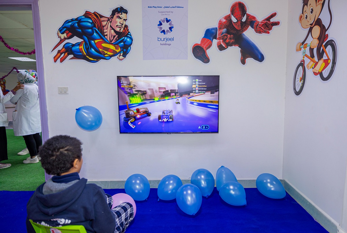 A child playing a video game at the recreational area set up by Burjeel Holdings at Al Arish Hospital